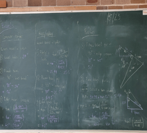 Some mathematics formula and equations on the chalk board